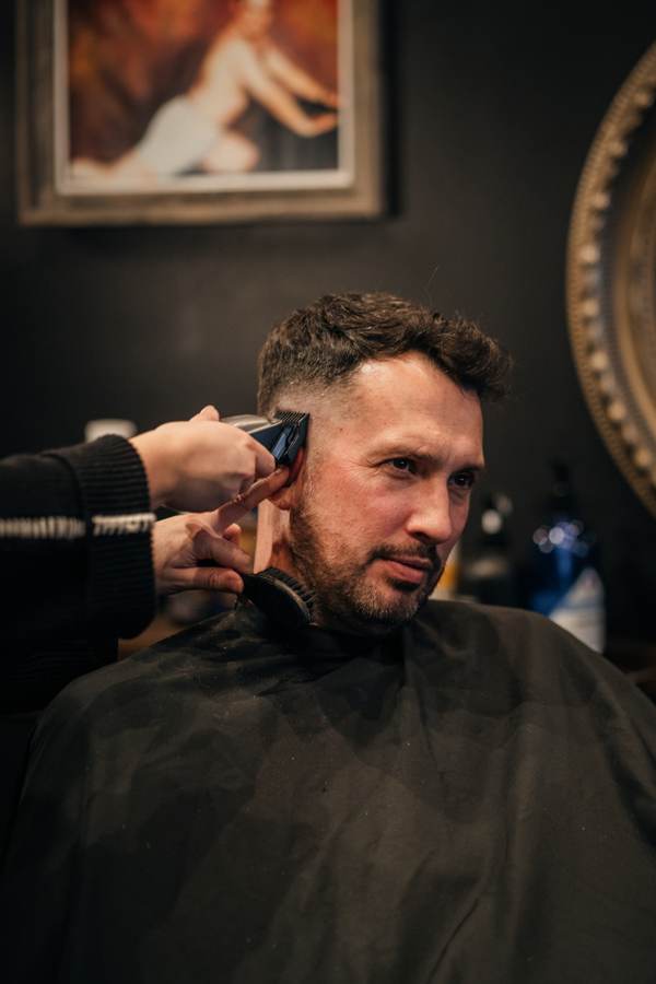 The Cave barber at work — The Line Work